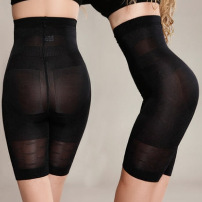 Black shapewear shorts on a neutral background