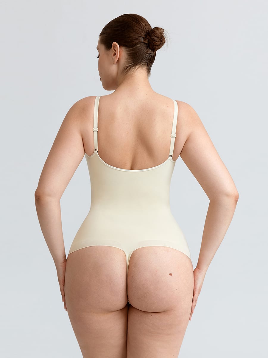 Naadloze V-hals body met geplooid borstgedeelte, buikcorrectie en string-model